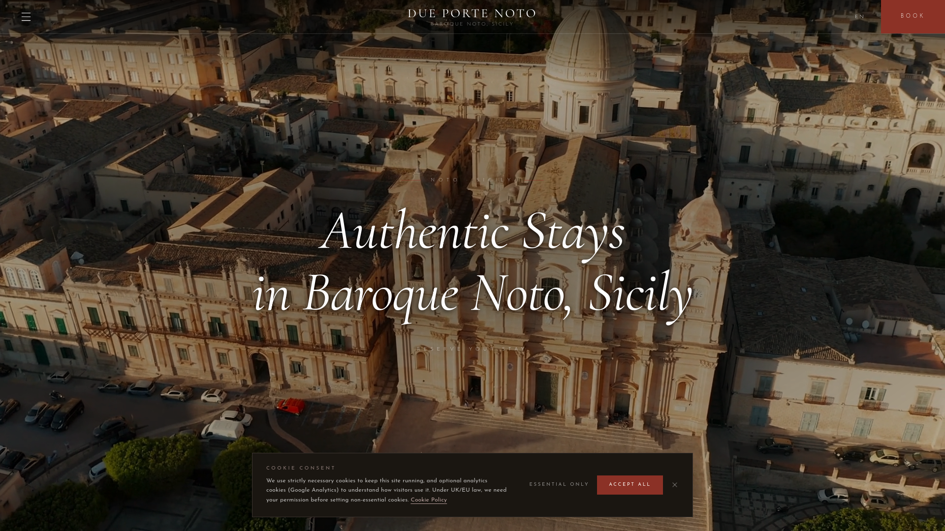 website screenshot of https://dueportenoto.com/